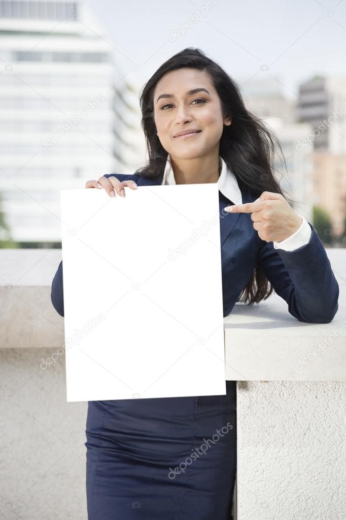 Indian businesswoman pointing Moodboard sign