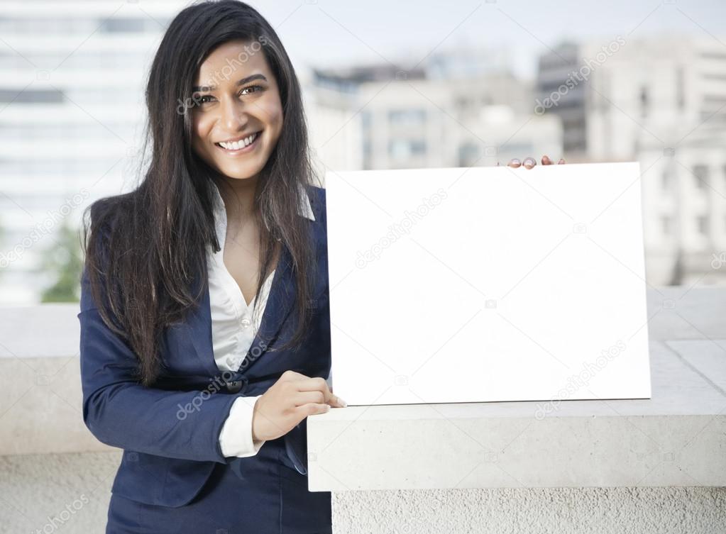 Indian businesswoman holding Moodboard sign