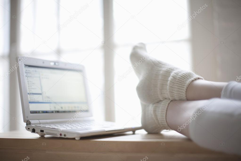 female Feet with laptop