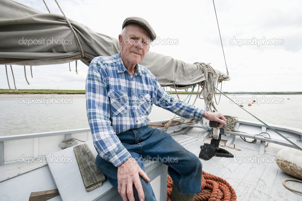 Fisherman sits on deck 