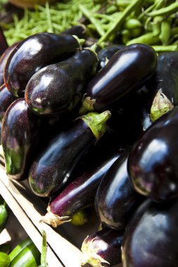 eggplants at market stall clipart