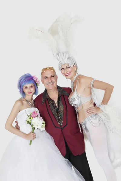 Man with senior showgirl and daughter in wedding dress — Stock Photo, Image