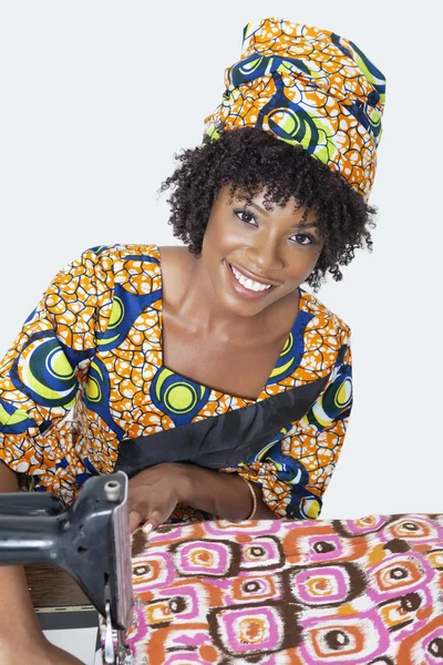 Dressmaker working on traditional outfit — Stock Photo, Image