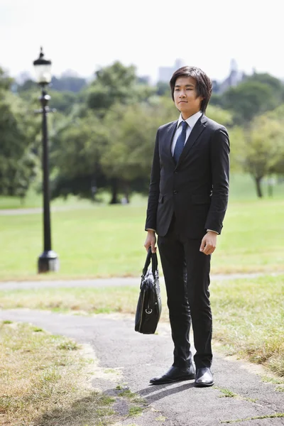 Businessman carrying briefcase — Stock Photo, Image