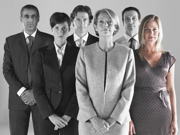 Ambitious businesswoman with team — Stock Photo, Image