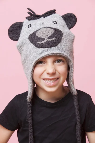 Young boy wearing monkey cap — Stock Photo, Image