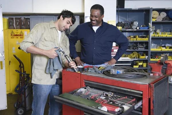 Two men in workshop with tools — Stock Photo, Image