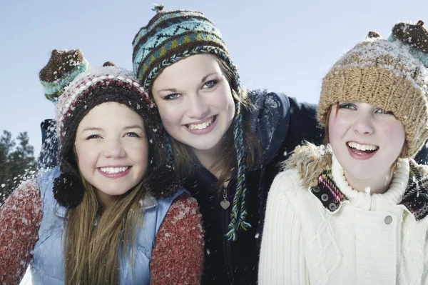 Three girls in winter clothing — Stock Photo, Image