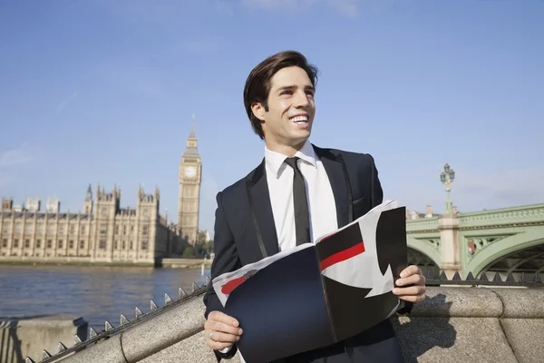Businessman with book against Big Ben — Stock Photo, Image