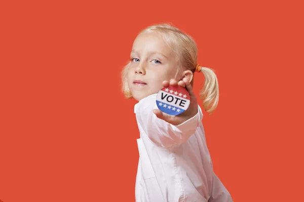 Girl showing vote badge — Stock Photo, Image