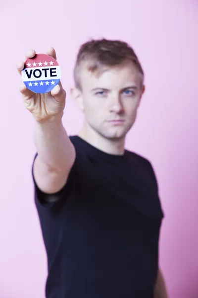 Man holding a VOTE badge — Stock Photo, Image