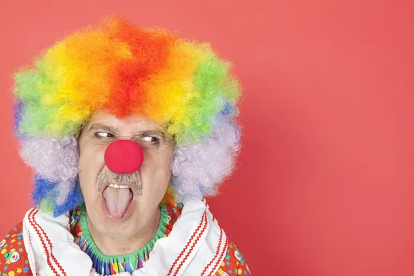 Senior clown sticking out tongue — Stock Photo, Image