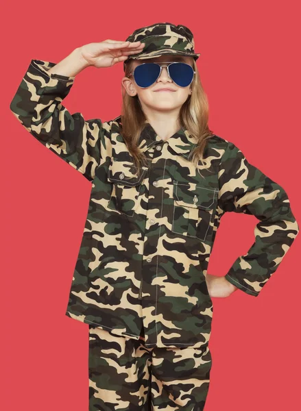 Girl in military uniform saluting — Stock Photo, Image