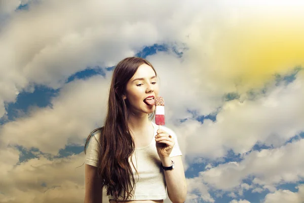 Beautiful young woman licking popsicle — Stock Photo, Image