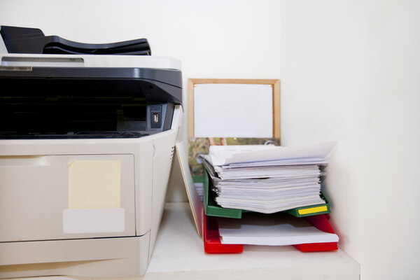 Printer and paperwork in real life office