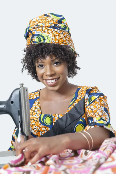 Dressmaker working on traditional outfit — Stock Photo, Image