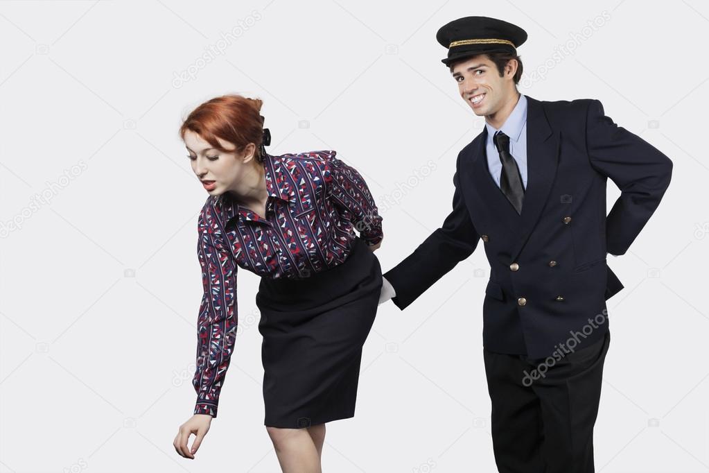 Pilot touching flight attendant