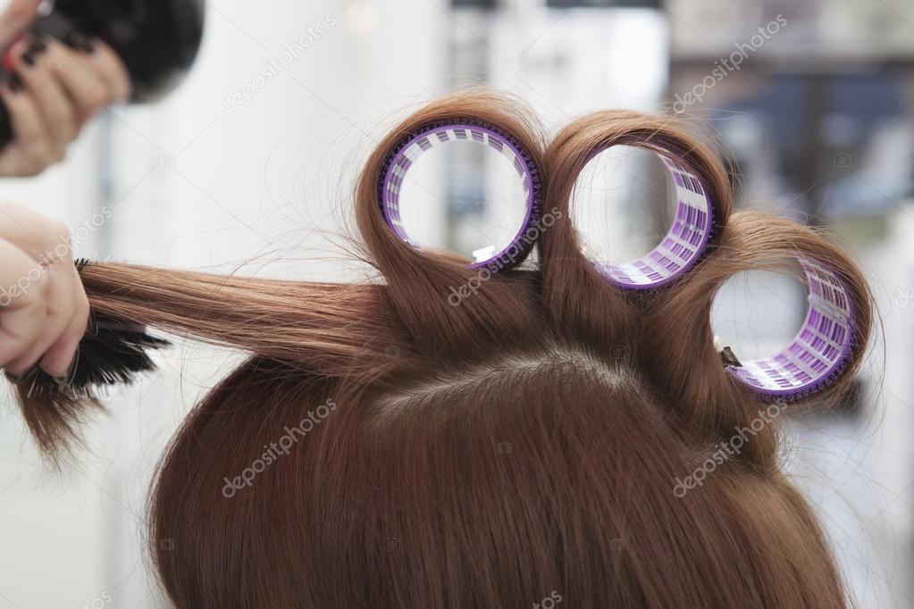 woman doing hairstyle at hairdresser 