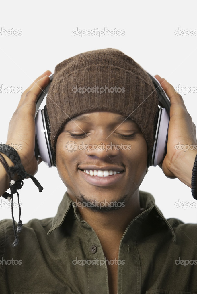 Relaxed young man listening music