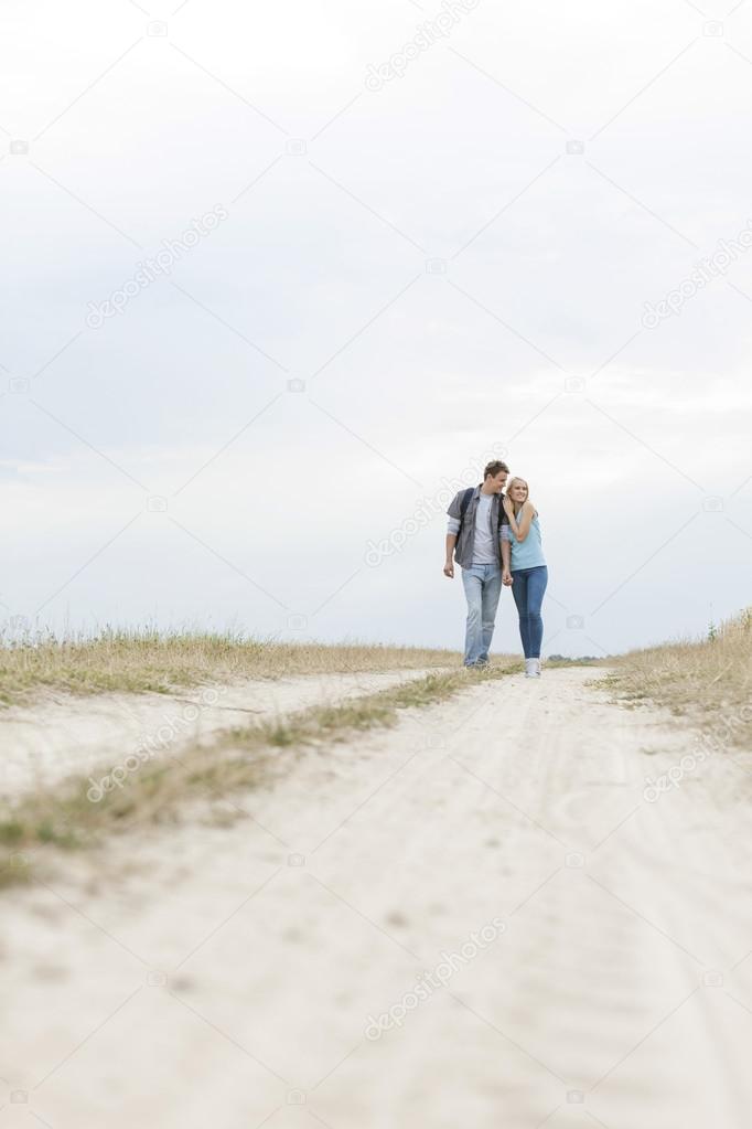 hiking couple walking on path