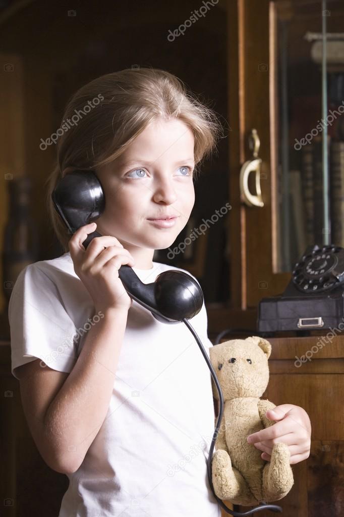 Girl using telephone