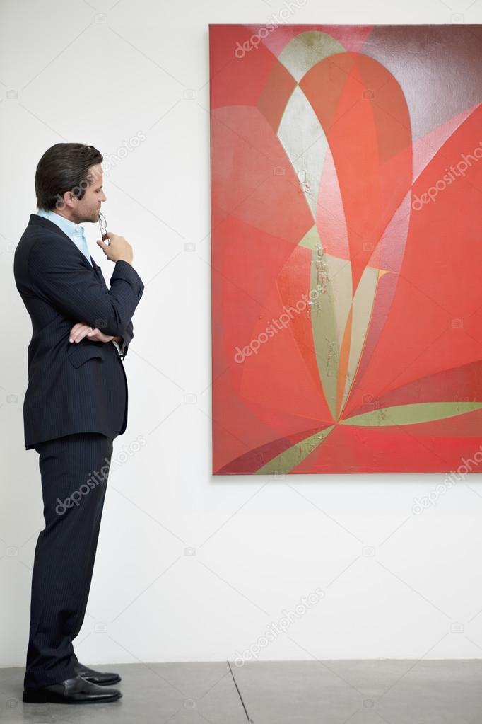 Man looking on painting
