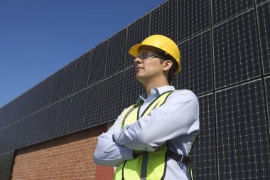 Maintenance worker with photovoltaic array clipart