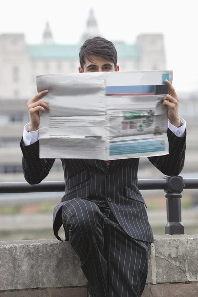 Businessman holding newspaper — Stock Photo, Image