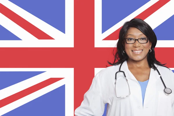 Female surgeon over British flag — Stock Photo, Image
