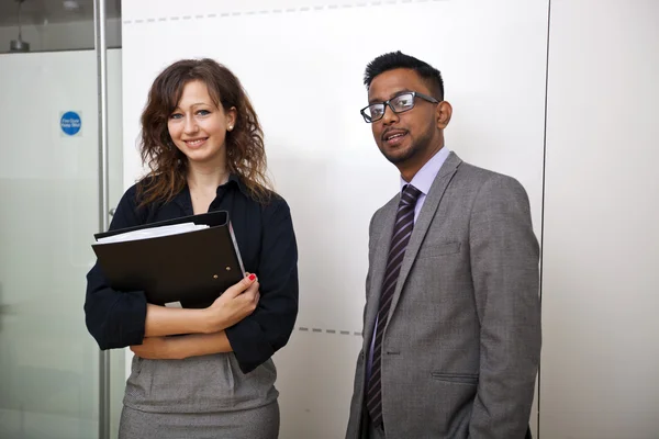 Work colleagues stand together — Stock Photo, Image