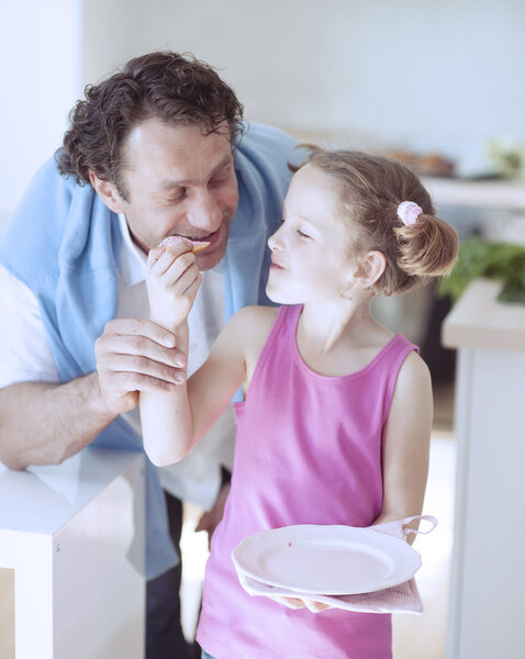  girl feeding father 