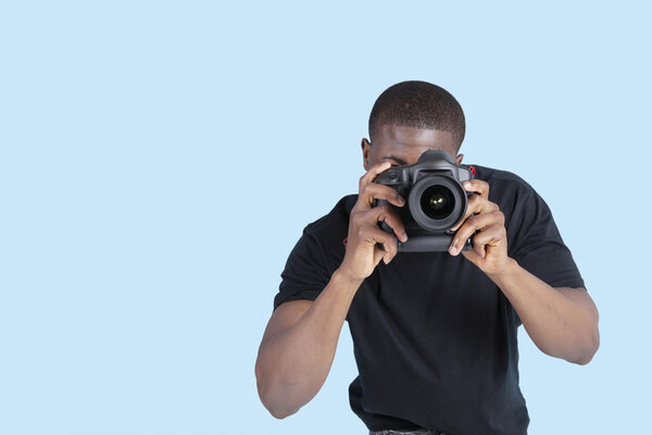 African American young man taking photo