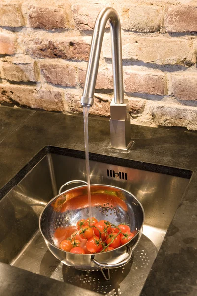 Red ripe Tomatoes washing — Stock Photo, Image