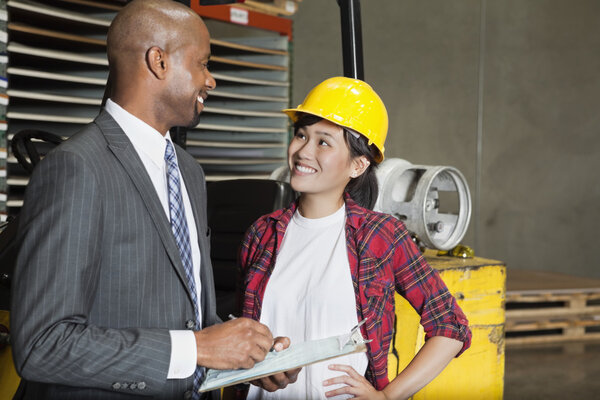 Industrial worker looking at inspector