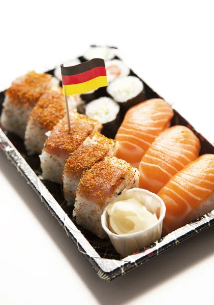 Comida de sushi en bandeja con bandera alemana —  Fotos de Stock