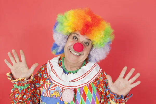 Funny clown with arms raised — Stock Photo, Image