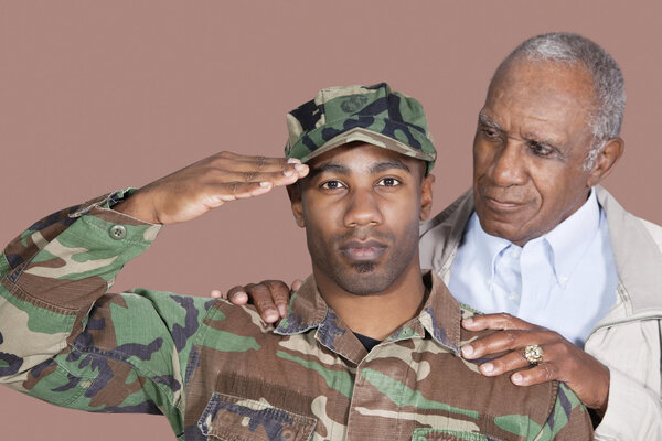 US Marine Corps soldier with father saluting
