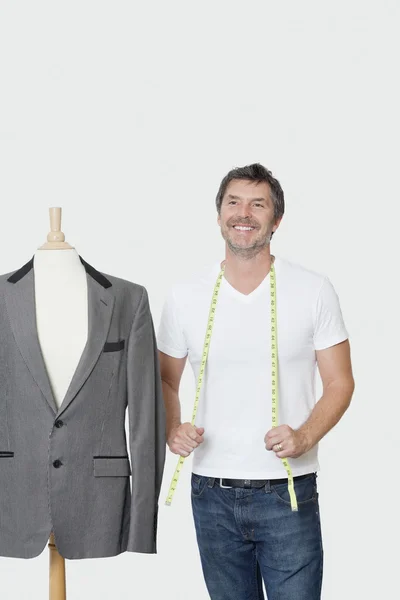 Dressmaker next to tailor's dummy — Stock Photo, Image