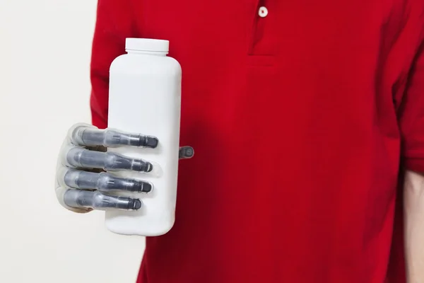 Man holding bottle with prosthetic hand — Stock Photo, Image