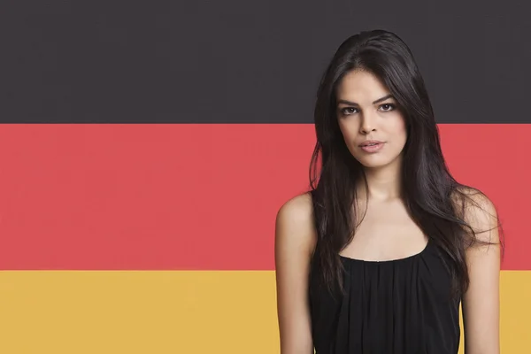 Woman against German flag — Stock Photo, Image