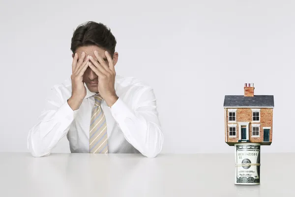 Businessman - increasing real estate rates — Stock Photo, Image