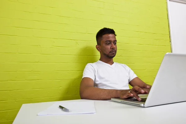 Indian man working at computer — Stock Photo, Image