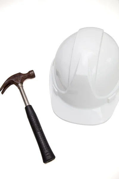 Hammer and hard hat — Stock Photo, Image