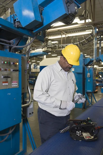 Man on newspaper factory — Stock Photo, Image