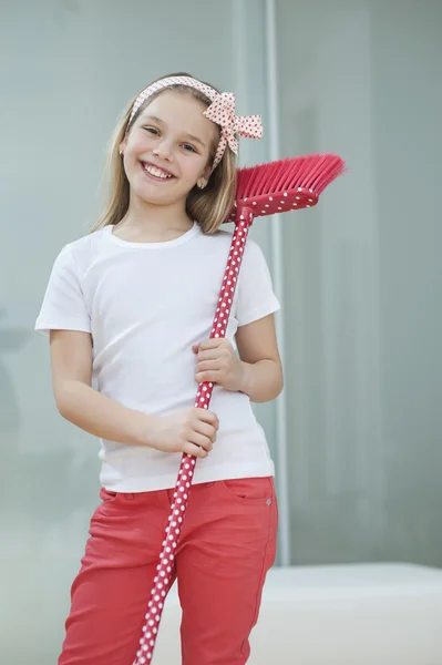 Girl with broom — Stock Photo, Image