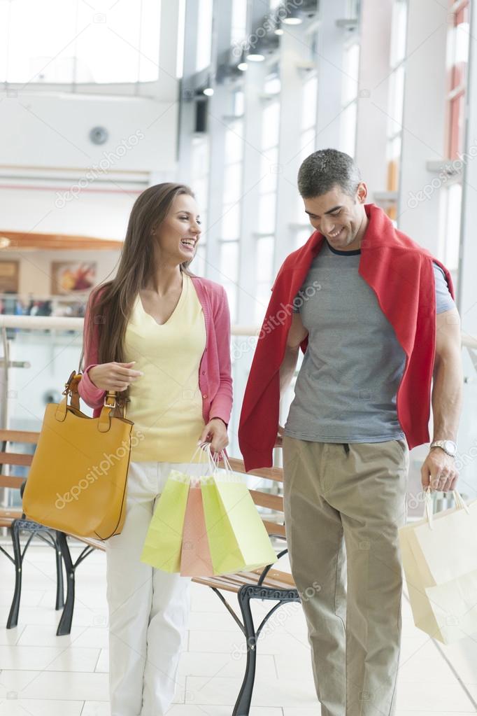 Couple with shopping bags in mall
