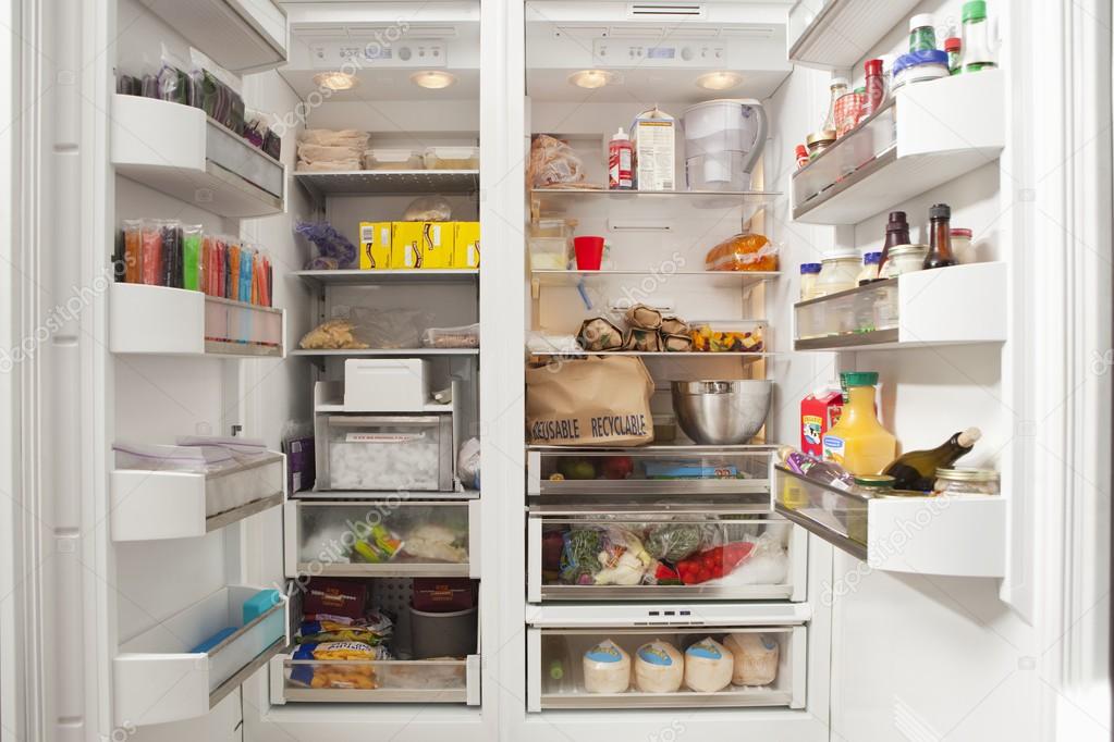 open refrigerator with food items 