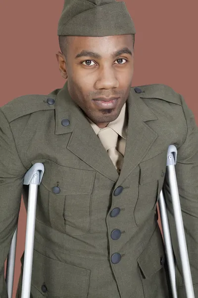 Military officer with crutches — Stock Photo, Image