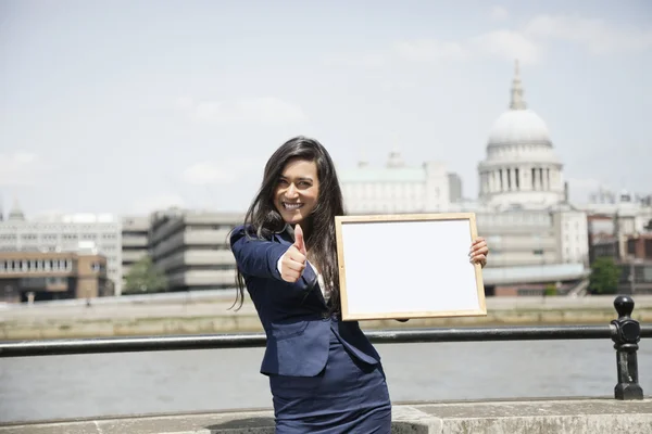 Indian businesswoman gesturing thumbs up — Stock Photo, Image