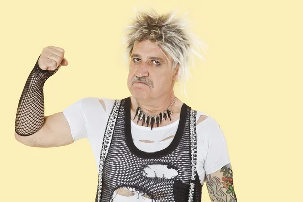 Senior male punk showing fist — Stock Photo, Image